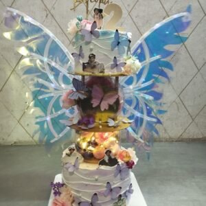 Elegant Fairy Wing Tiered Cake by Bakers Home Bengaluru