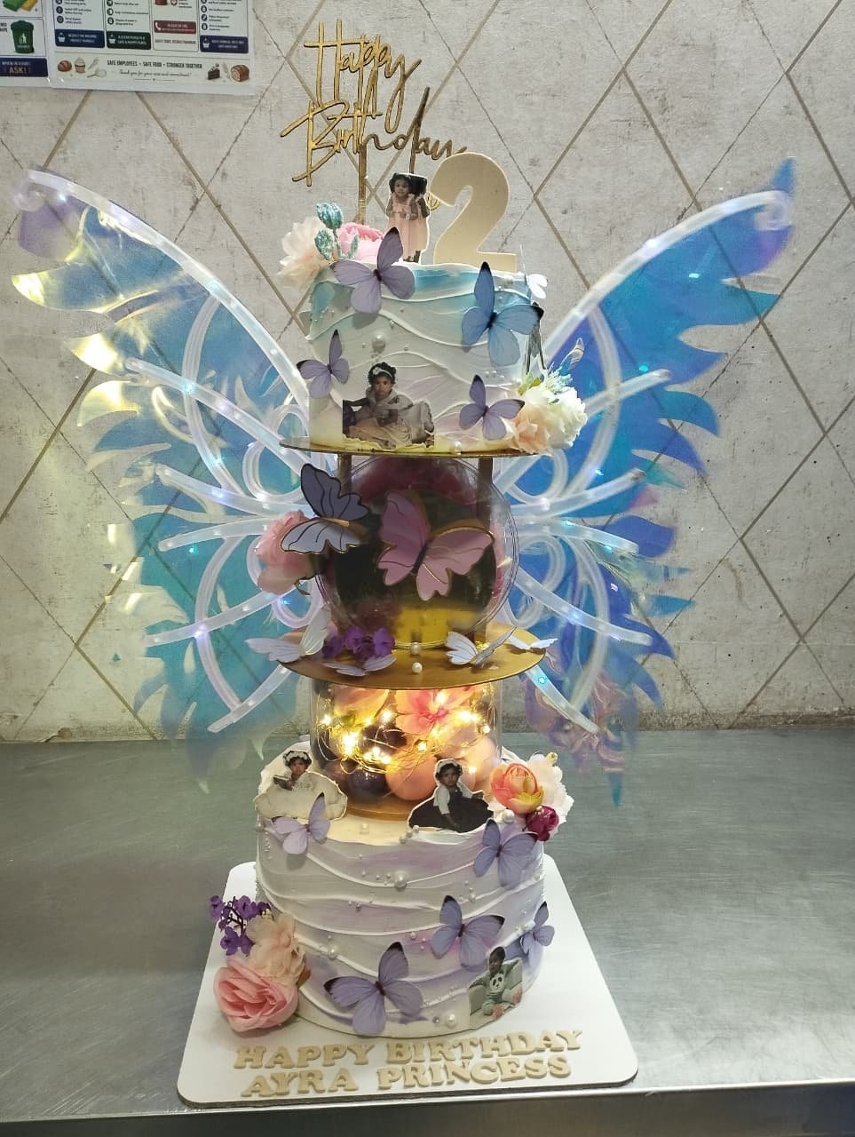 Elegant Fairy Wing Tiered Cake by Bakers Home Bengaluru