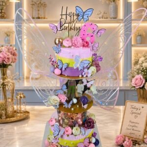 Pastel Tiered Cake with Fairy Figure by Bakers Home Bengaluru