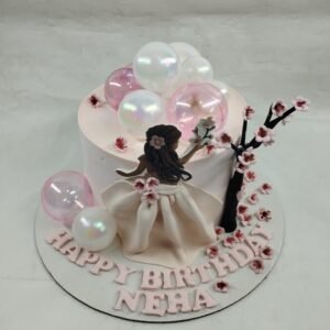 Pink Floral Cake with Figure by Bakers Home Bengaluru